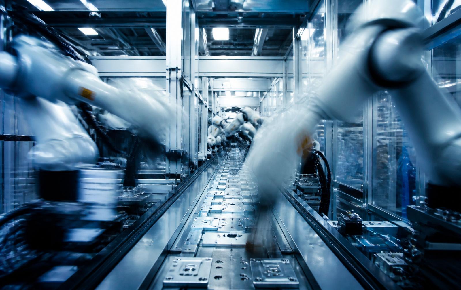 Automated production line running at speed inside a factory